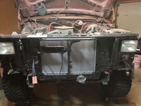 Vehicle front end with radiator and headlights installed