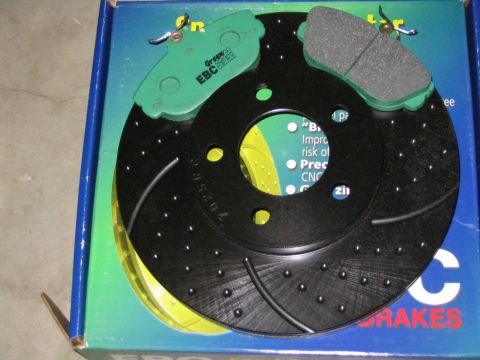 1996 Mercury Sable - A set of EBC Greenstuff brake pads and a performance brake rotor are shown in their packaging.