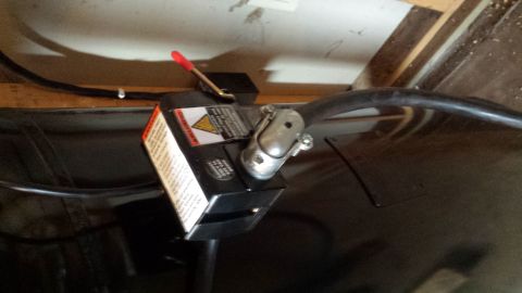Pressure switch with warning label mounted on an air compressor