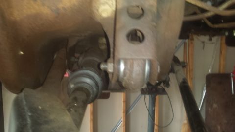 Front suspension, axle shaft, and frame of a truck from underneath