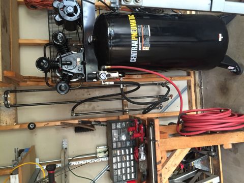 Photo of a Central Pneumatic air compressor in a garage