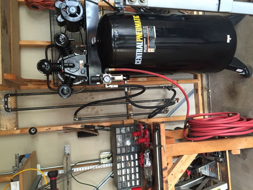 Photo of a Central Pneumatic air compressor in a garage