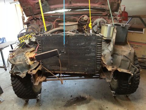 Photo of a truck front clip with exposed radiator and engine bay