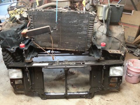 Photo of a truck front clip with radiator and core support exposed