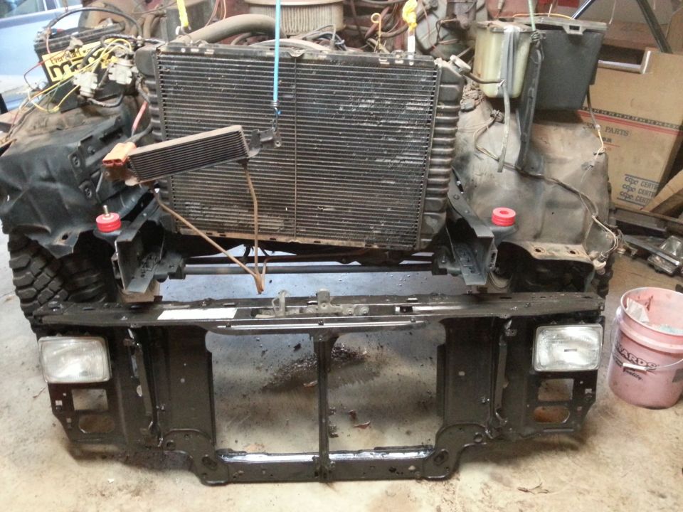 Photo of a truck front clip with radiator and core support exposed
