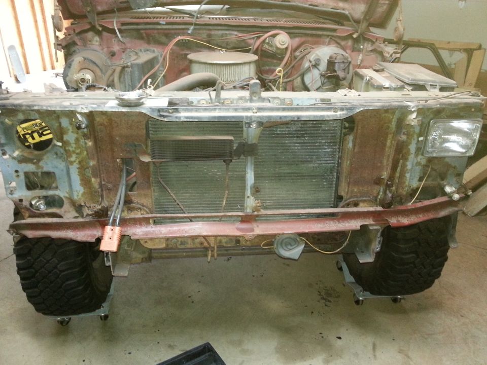 Photo of a truck front end with grille and radiator support removed showing radiator