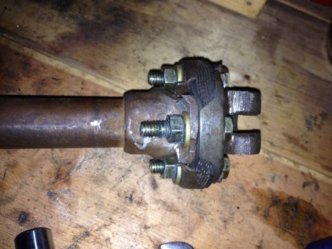 Close-up photo of a bolted flange joint on a shaft