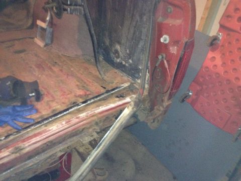 Photo of a vehicle rocker and cab corner during rust repair