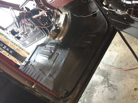 Photo of a vehicle cab floor pan during replacement
