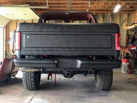 Rear view of project truck with coated tailgate in a garage