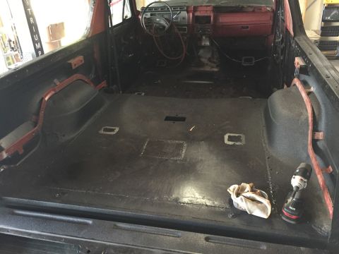 Stripped interior of a project truck cab and cargo area