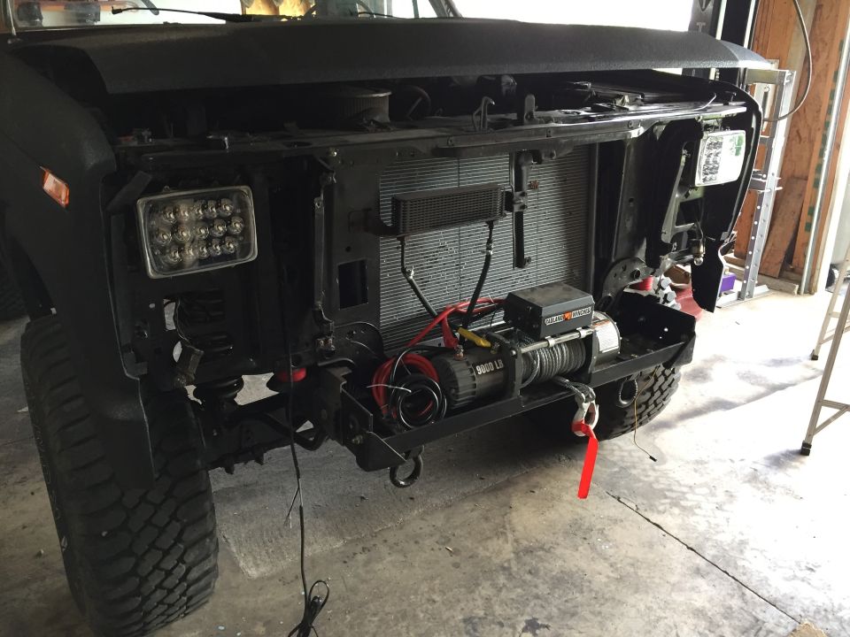 Truck front with LED headlights and winch mounted behind bumper