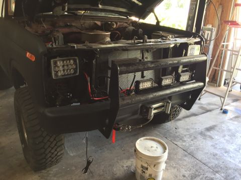 Truck front with hood open, LED lights and winch mounted