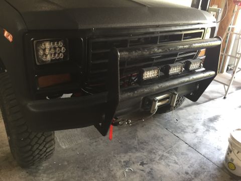 Black Ford truck front bumper, grille guard, and LED light bars