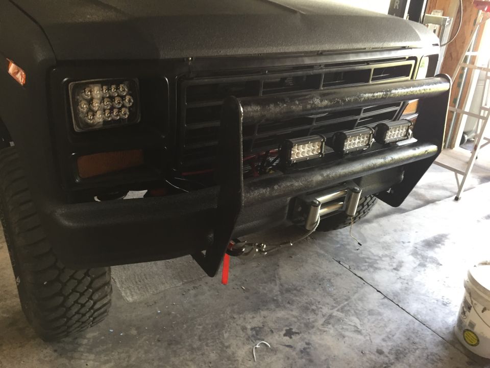 Black Ford truck front bumper, grille guard, and LED light bars