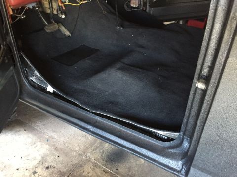 Black carpet and door sill of a Ford truck interior