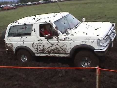 1989 Ford Bronco - This white 1989 Ford Bronco is covered in mud after an off-road event.
