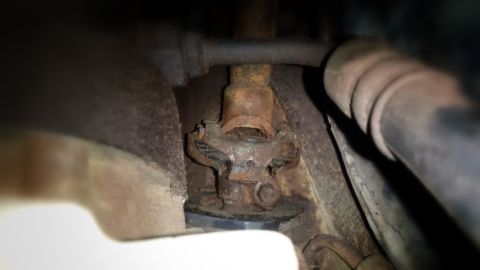 Rusty universal joint in a vehicle's undercarriage