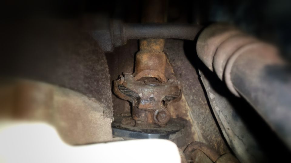Rusty universal joint in a vehicle's undercarriage