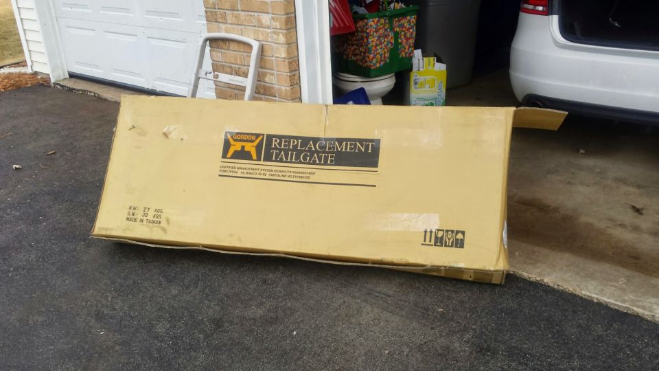Cardboard box for a replacement tailgate, labeled "GORDON REPLACEMENT TAILGATE".