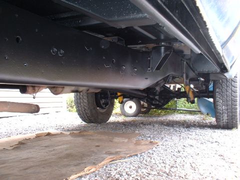 1978 Ford F-250 - Undercarriage of a 1978 Ford F-250 showing the frame, suspension, and exhaust system.