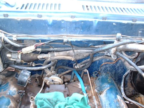 1978 Ford F-250 - Close-up view of a vehicle's engine bay, showing various mechanical parts and wiring.