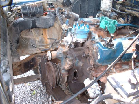 1978 Ford F-250 - Close-up view of a vehicle's engine bay, showing various components and some rust.