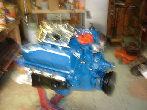 1978 Ford F-250 - Engine assembly in a garage, mounted on a stand for rebuilding or repair.