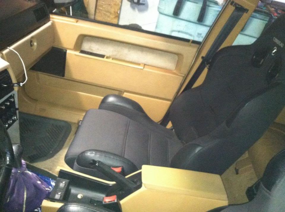 1991 Volvo 940 interior with tan door panels and black racing seats