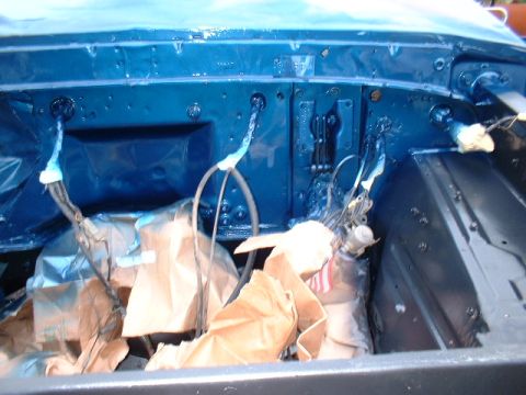 1978 Ford F-250 - The engine bay is painted blue, with various components covered in protective brown paper for a rebuild.