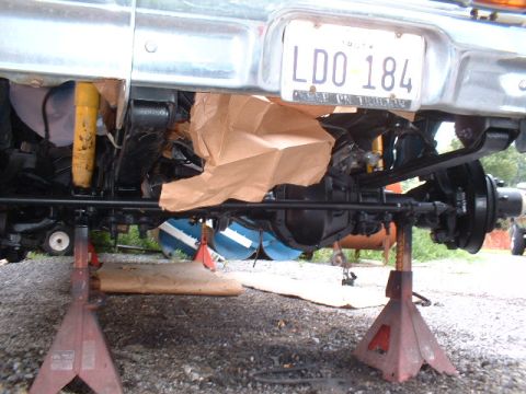 1978 Ford F-250 - The rear suspension and axle assembly of a truck are visible, supported by jack stands.