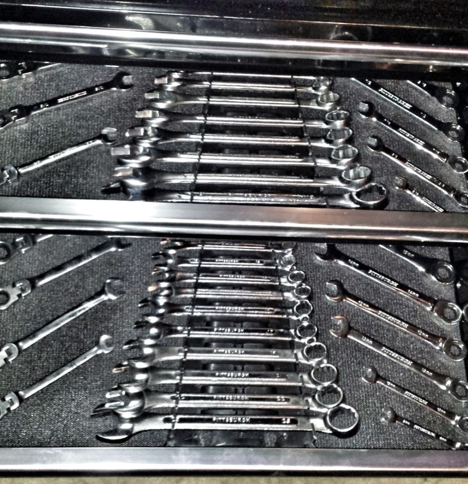 Toolbox drawer filled with wrenches