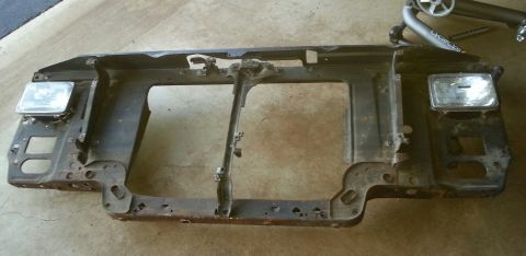 Front radiator support assembly with headlights from a vehicle.