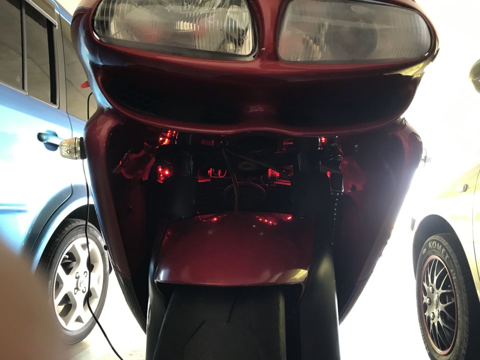 Red motorcycle front view with red LED accent lights