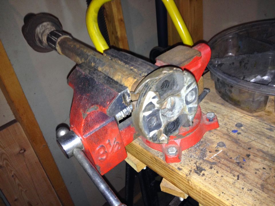 Part held in a red 3 1/2 inch vise on a workbench