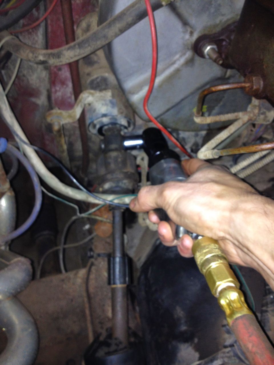 Working on steering column with air ratchet. Looks like a Ford Bronco