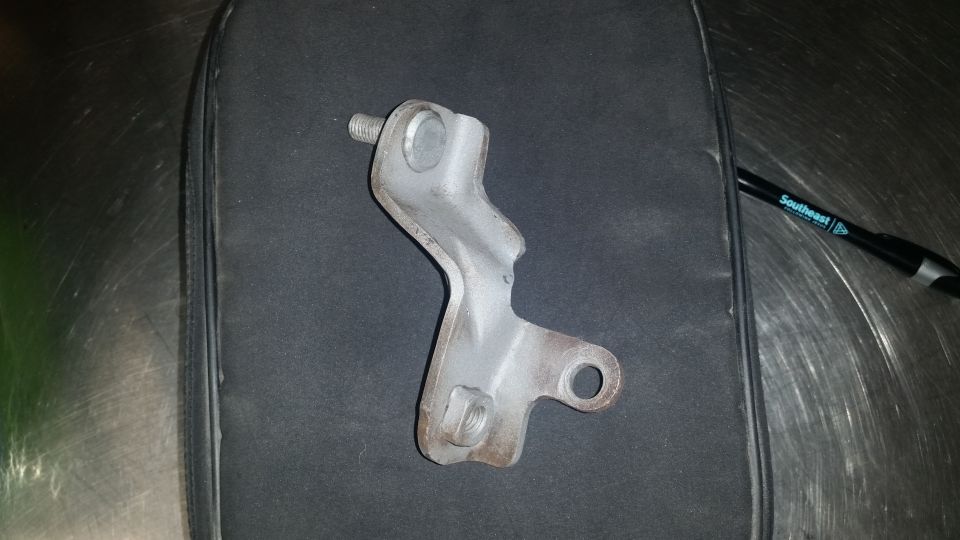 Metal bracket with bolt and nut