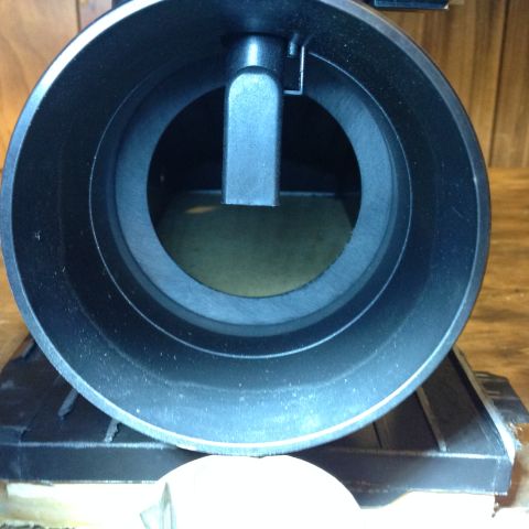 1996 Ford Bronco - This is a close-up, head-on view of a black mass air flow sensor housing. The interior of the housing shows a sensor element and a mounting…