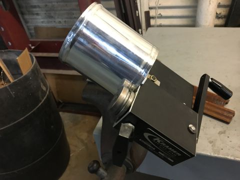1996 Ford Bronco - A close-up of a metal bending tool with a silver cylinder and black housing, featuring a crank handle and a label that reads "KRAMER METAL…