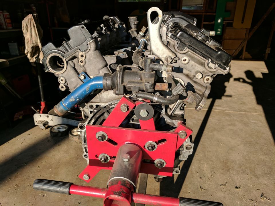 V6 engine on a red engine stand