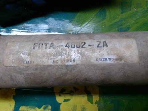 1996 Ford Bronco - Close-up of a Ford engineering part-identification tag reading FDTA-4602-ZA dated 04/29/96 on a driveshaft tube.