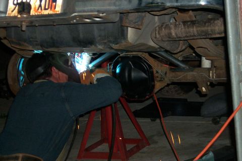 1996 Ford Bronco - This is Scott welding on the 8.8 axle truss.
