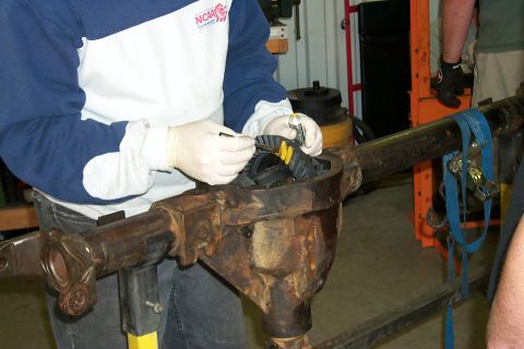 1996 Ford Bronco - Putting the finishing touches on the gear install on my D44. Doug is just applying the marking compound before it was all done.