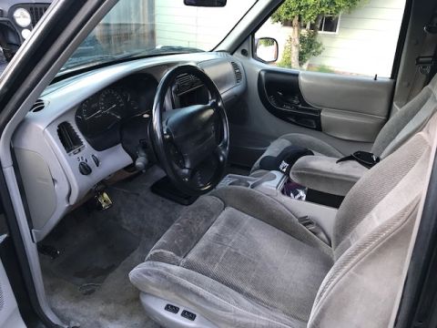 1986 Ford Bronco - Interior of a Ford Ranger pickup truck, likely from the late 1990s.