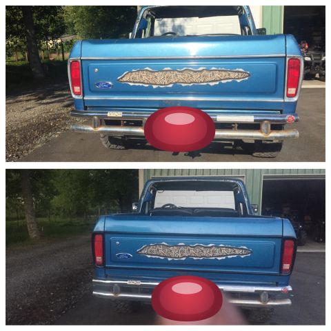 1979 Ford Bronco - Rear view of a blue 1979 Ford Bronco showing the tailgate with a unique decal.