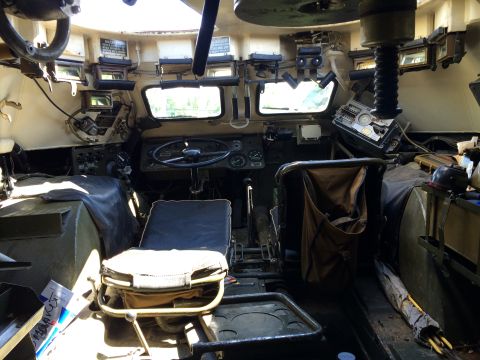 1993 Ford Bronco - The interior of a military vehicle shows a complex dashboard and seating arrangement.