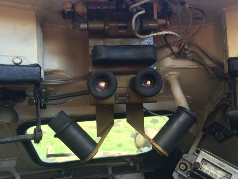 1993 Ford Bronco - Binoculars and various controls are visible from the interior of a vehicle.