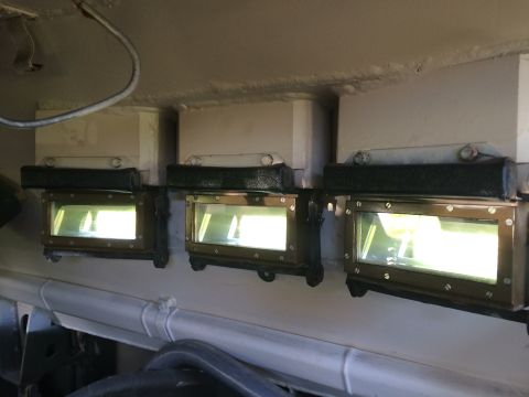 1993 Ford Bronco - Interior view of three illuminated rectangular lights with glass lenses.