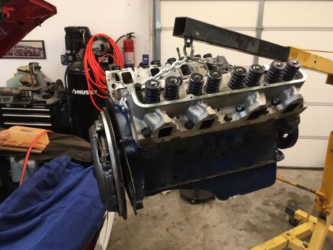 1968 Shelby GT500 - Engine block and clutch assembly suspended by an engine hoist, ready for installation or removal.
