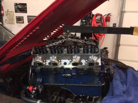 1968 Shelby GT500 - Engine components are visible as they are being worked on in a garage setting.